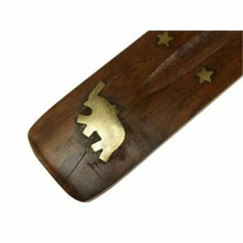 A Поставка за ароматни пръчици with an elephant on it.