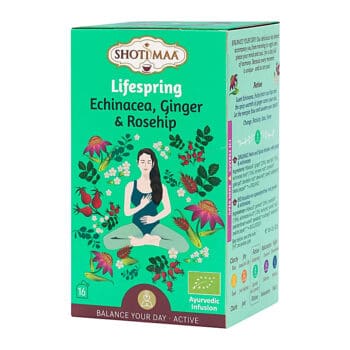 Кутия с Органичен чай Ройбос Numi Organic Tea Rooibos. Опаковката е зелена с флорални мотиви и илюстрация на медитираща жена.